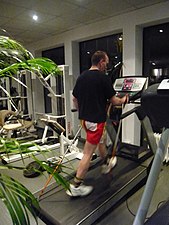 Nordic walking on a treadmill in a health club...